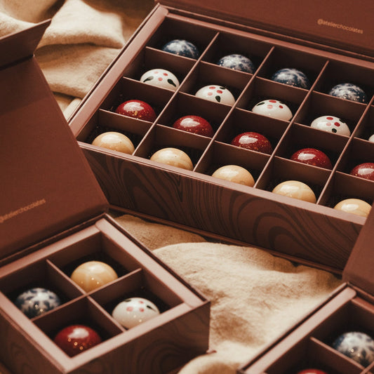 Boxes of Christmas themed hand made chocolates in gift boxes